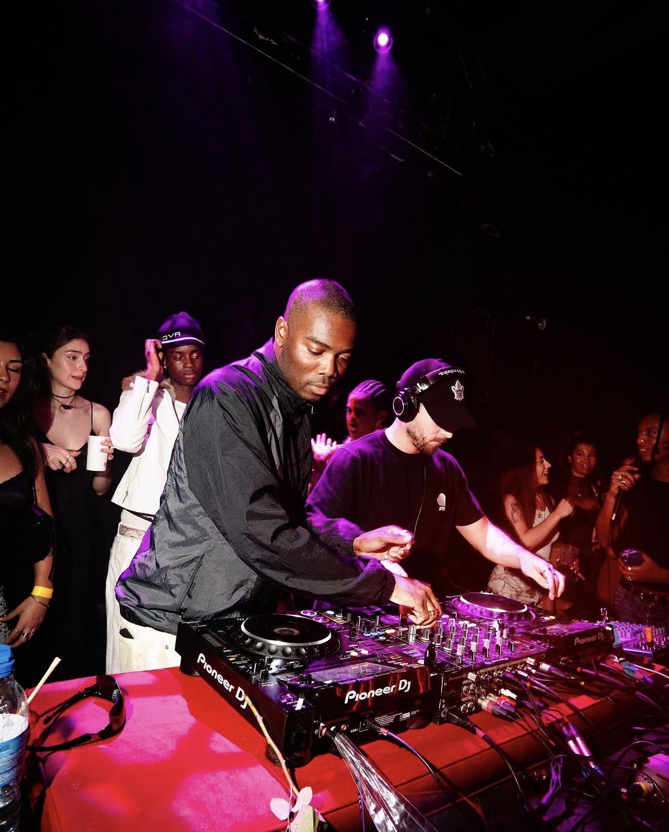 Pioneer DJ booth under red stage light